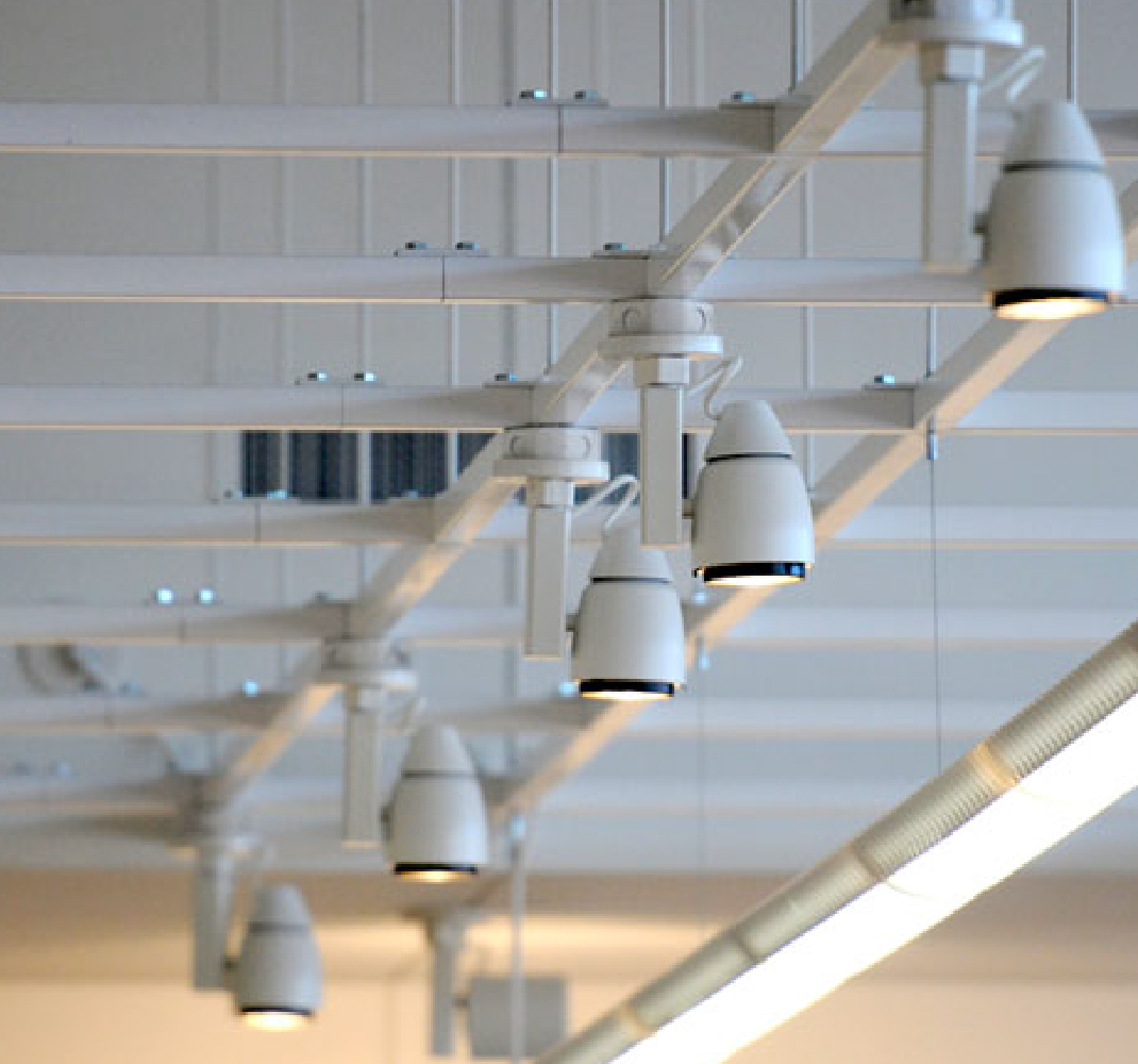 Image of the inside non-residential building strut system on the ceiling to hold lighting